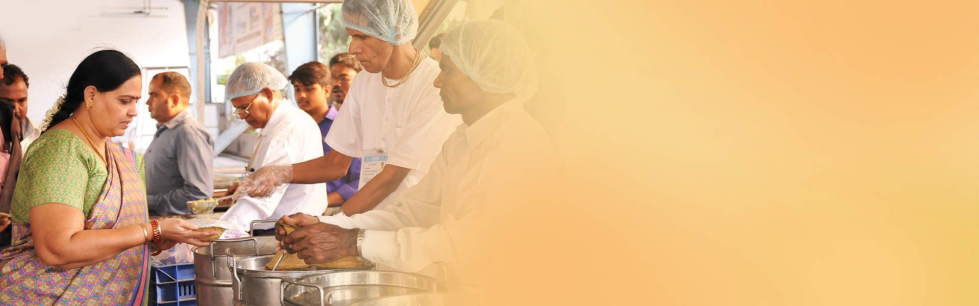 Devotees at prasadam seva